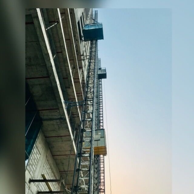United Rental construction hoist at a building site